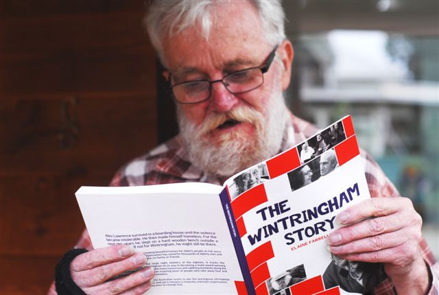 Alex Lawrence, whose home is at Wintringham Port Melbourne, getting his first look at the book in which he is featured